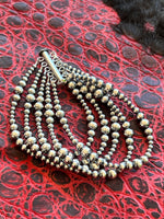 
              5 Strand Graduated Pearl Bracelet
            