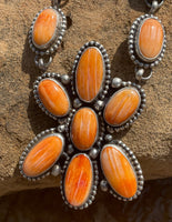 
              Travis Jim Orange Spiny Cluster Lariat & Earrings
            