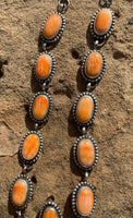 
              Travis Jim Orange Spiny Cluster Lariat & Earrings
            