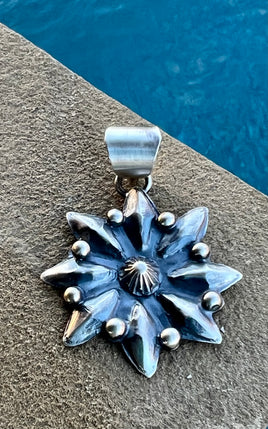 Juanita McDonald Long Starburst Stamped Pendant